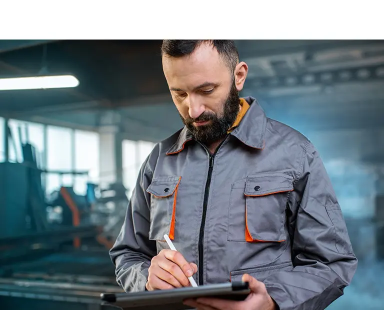 HxGN EAM Facilities Edition - worker with a tablet